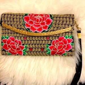 Hand stitched clutch